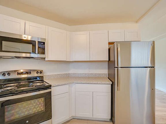 New stainless steel dishwasher, oven, microwave and refrigerator.