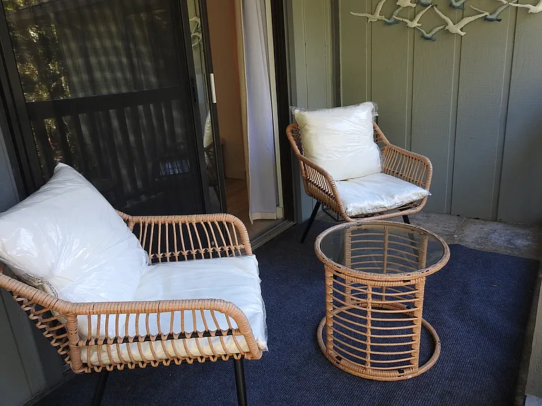Cozy quiet morning coffee spot off the primary bedroom on second floor deck