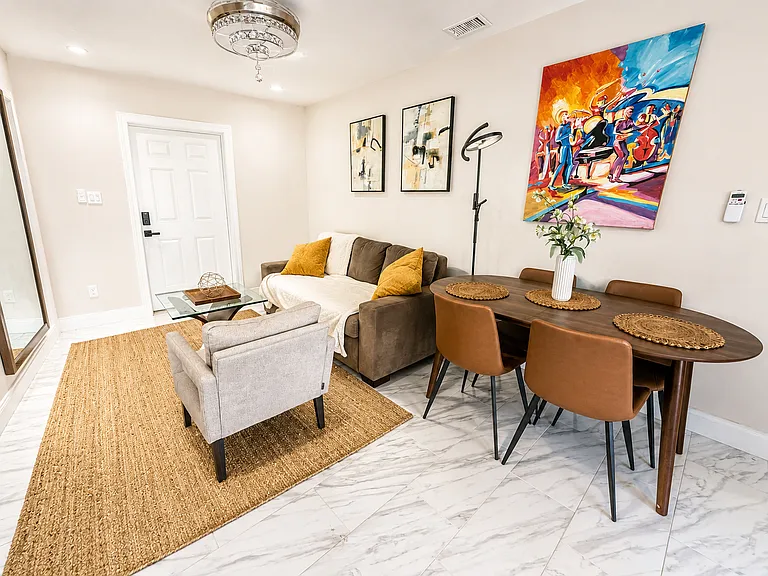 Comfortable queen sleeper sofa in the private guest suite, adding flexible sleeping space for larger groups and multi-generational Naples stays.