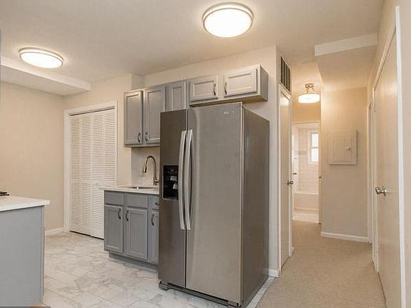 Standing in the Living Room looking at the Kitchen and the H