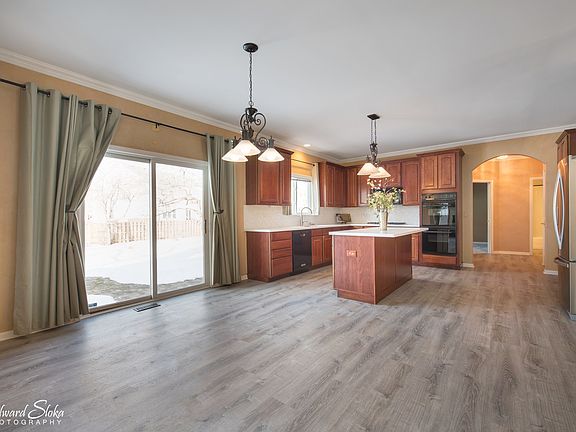 BREAKFAST AREA WITH ACCESS OUT TO THE BACK YARD