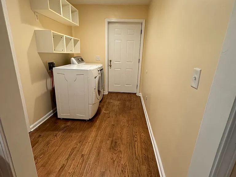Laundry room with side exterior door