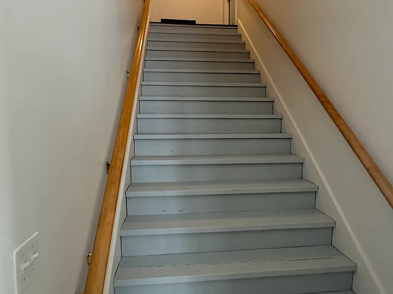 Shared extra wide stairway to two upper apartments