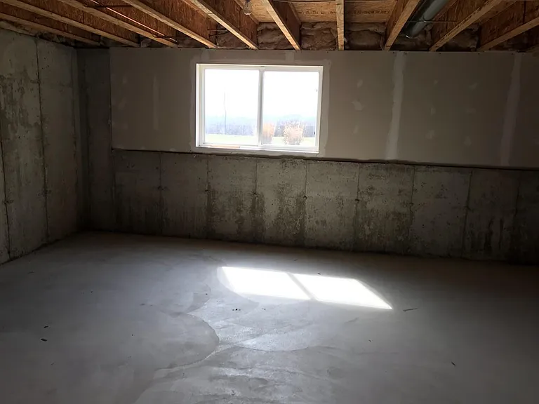 basement with bright light from big windows