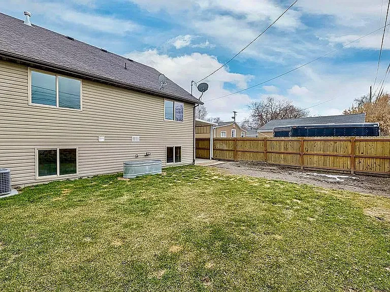 Fully fenced yard for the use of the basement tenant only.