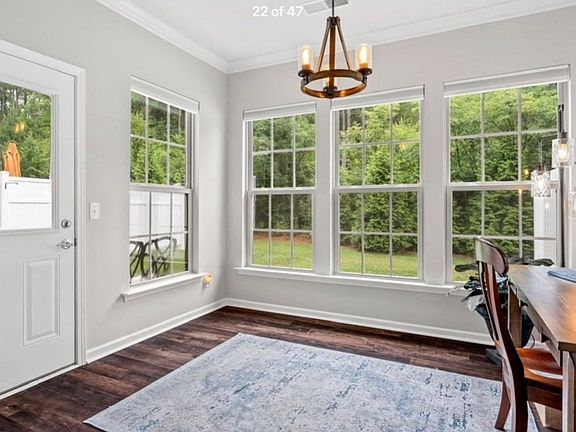 Sunroom or office with beautiful wooded view and lots of natural light