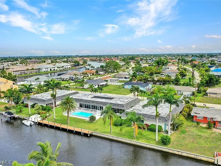 Aerial view of the property showing that it is a small, 3 building complex