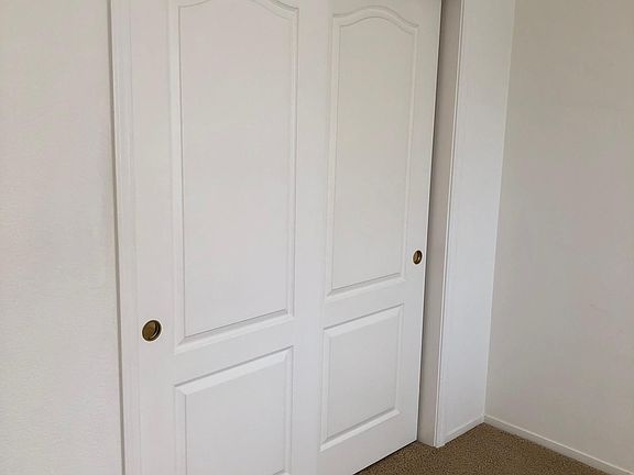 Guest bedroom. Large closet with multi-level shelves.