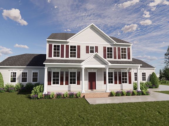 A large, two-story white house with red shutters in Scotchtown Estates, surrounded by greenery under