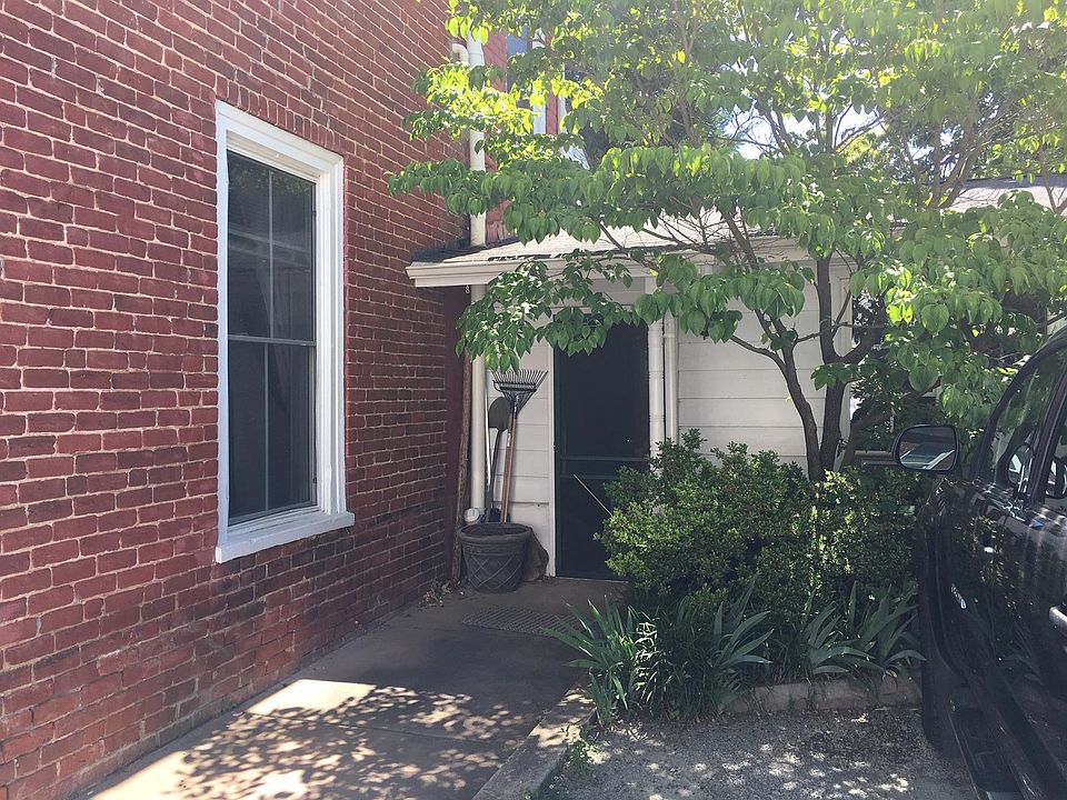 Private entry on the backside of the house with reserved parking space.