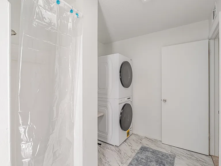 Laundry room with shower and the storage