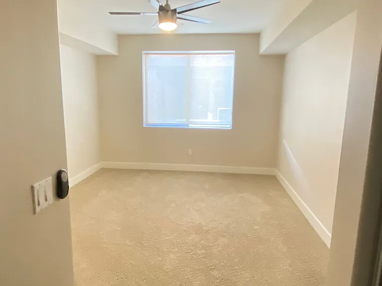 Remote controlled ceiling fan in bedroom