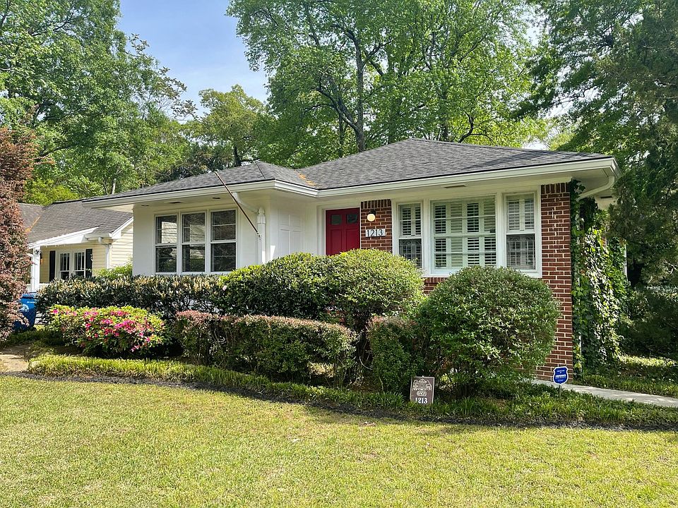 Front door w/ mailbox on front porch. Large front yard on corner lot makes for great curb appeal.
