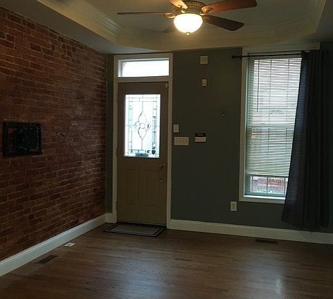 Living room with exposed brick