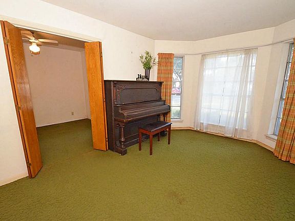 The formal living features a bay window. It is connected to the formal dining but can be easily separated. Great room for teaching piano lessons!