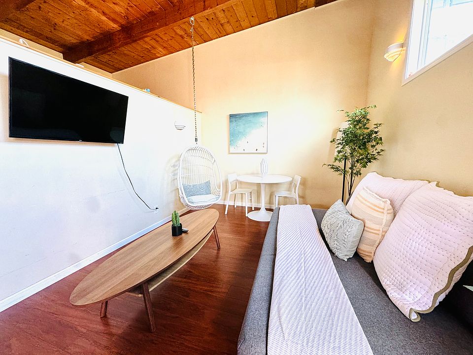 Cozy living room with all linens included. Enjoy the comfort of provided towels, extra sheets, and blankets for your stay.