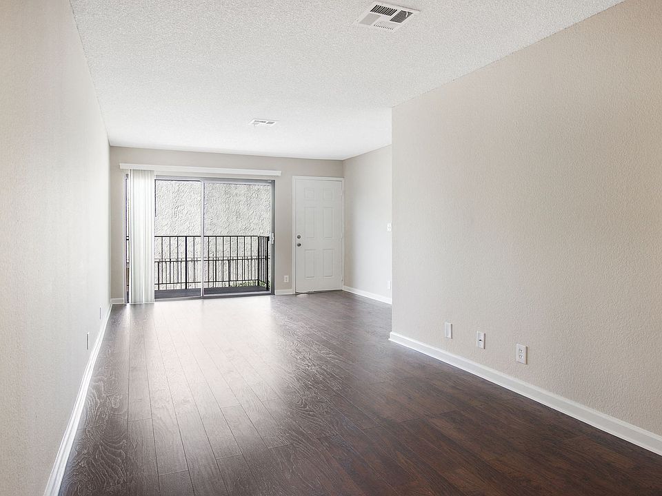 Sunlit hallway with hardwood floors