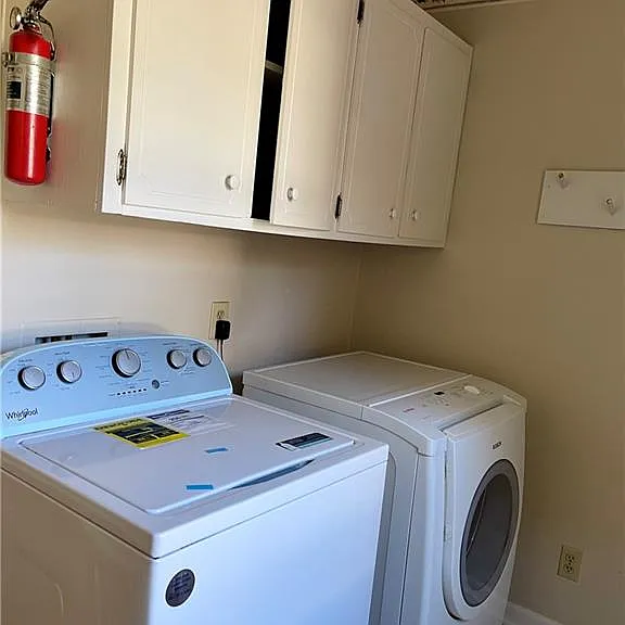 A separate Laundry Room with plenty of shelves.
