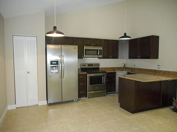 NEW ALL WOOD CABINETS & SS APPLIANCES