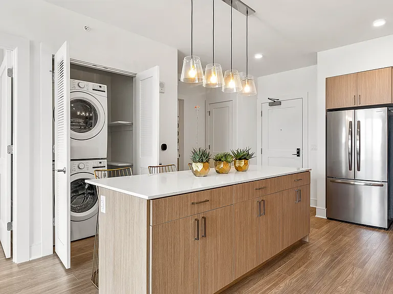 Enjoy the convenience of in-unit laundry just steps from your kitchen.
