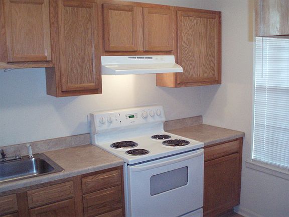 Kitchen is nicely equipped with range/oven, refrigerator, di