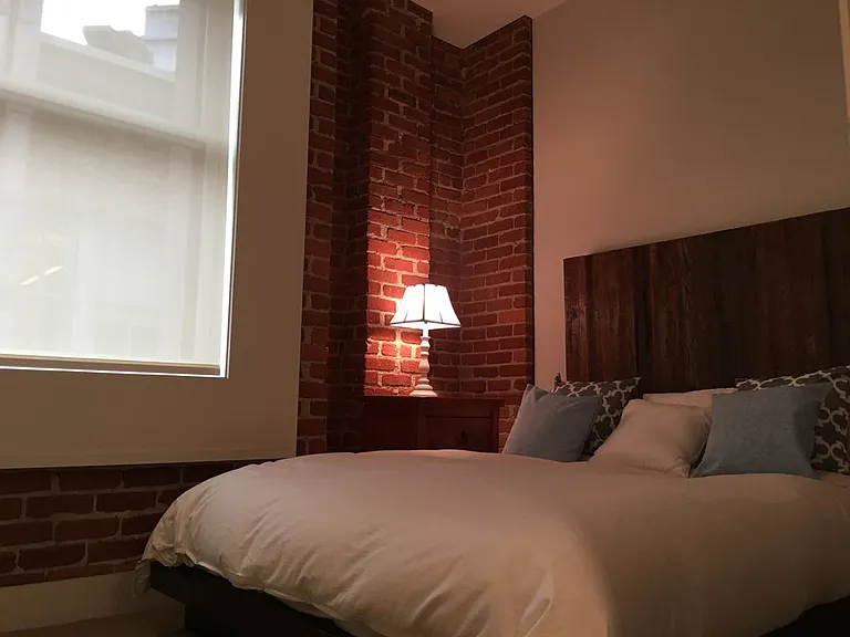 Bedroom with automated sheer & blackout shades