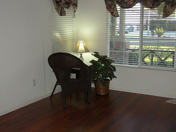 Spacious Living Room with laminate cherry flooring