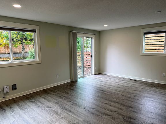 Enter into the living room, with sliding glass door, from the garage