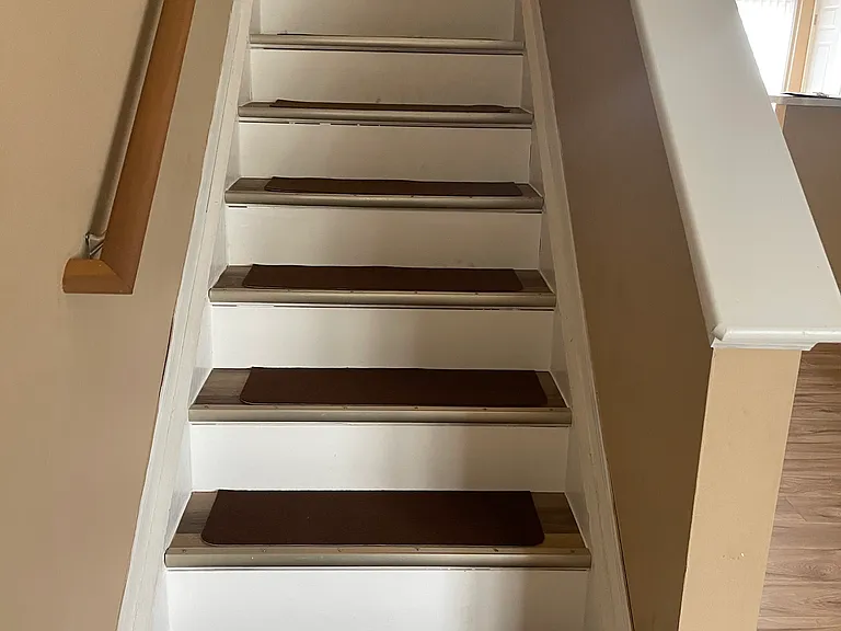 wood stairway to upstairs