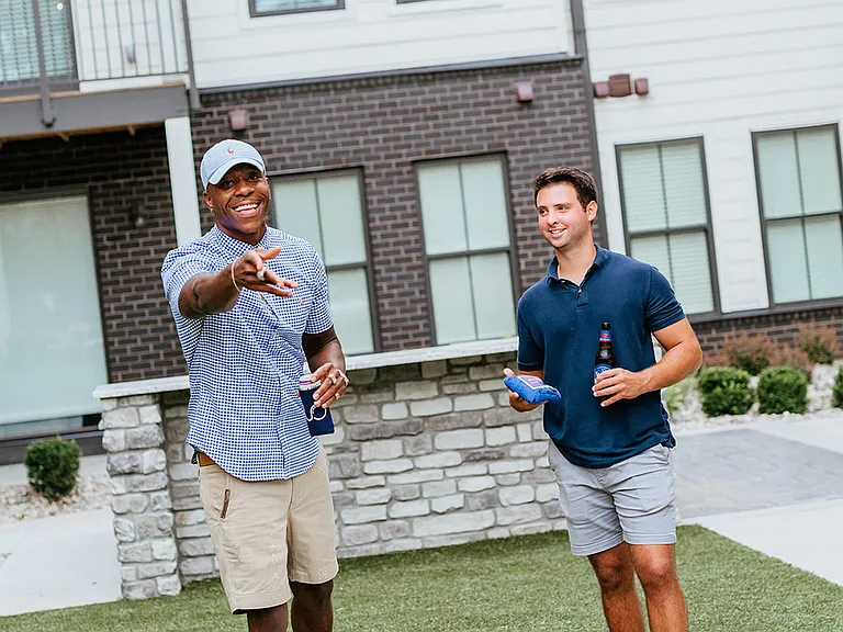 Outdoor courtyard with cornhole