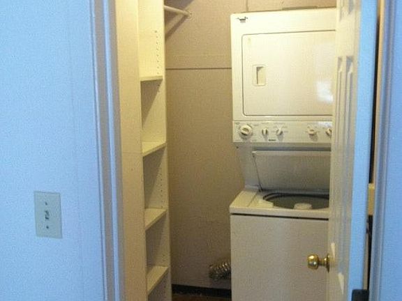 walk in closet with washer/dryer