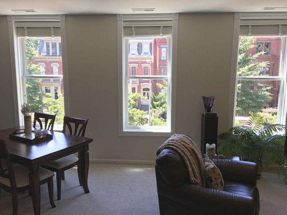 Three big windows face beautiful Vermont Ave.