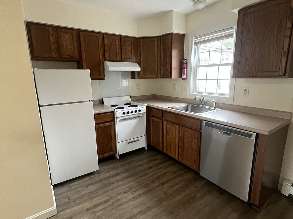 Kitchen with electric stove, refrigerator, and dishwasher
