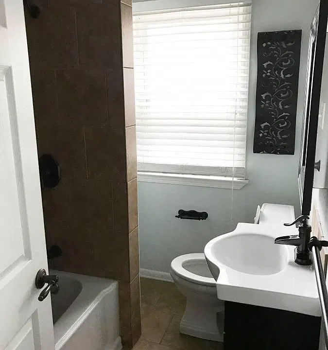Updated bathroom with hidden behind. the shower storage (not shown)