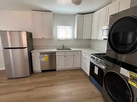 Kitchen with brand new appliances and flooring