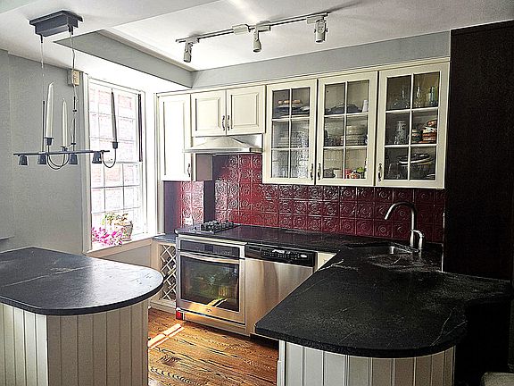 Kitchen with undercounter fridges, oven and Miele burners