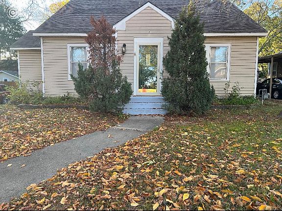 Front of the house, large fenced back yard with two patio's. Detached garage with covered driveway.