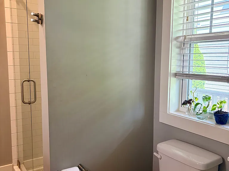 Downstairs bathroom for the third bedroom and visitors. *NOTE: house comes unfurnished (pics show current owner's furnishings that will be moved).*