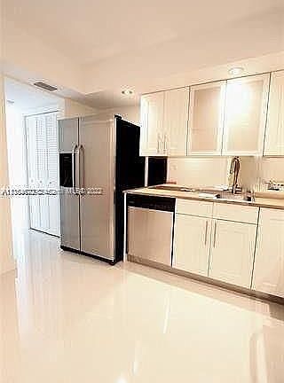 3rd image of 9500 W Bay Harbor Dr APT 3F