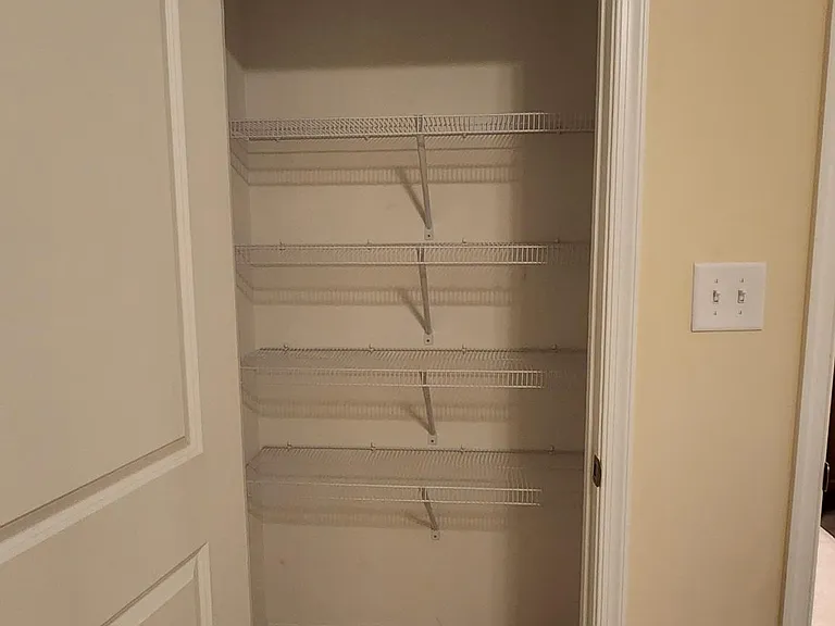 linen closet in the master bedroom