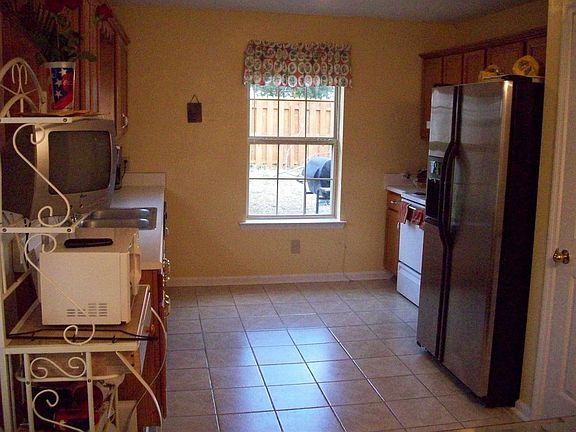 Custom tile floor in this adorable kitchen