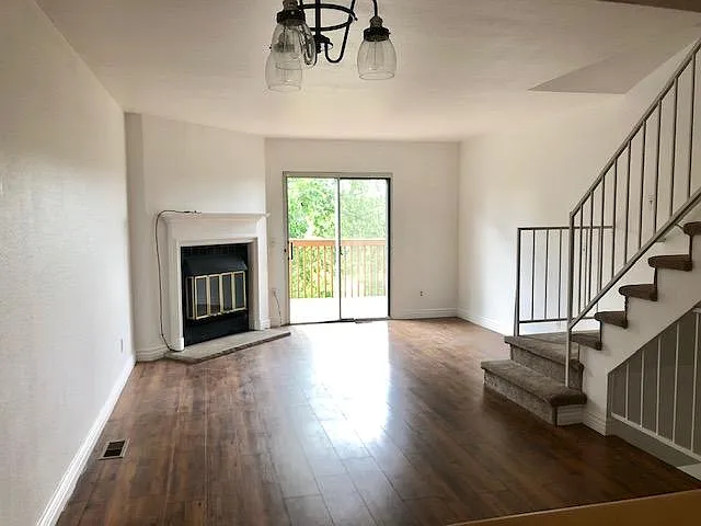 Main level living & dining room featuring a fireplace