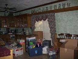 Kitchen area. Owner in the process of clearing out the home.