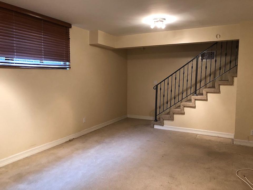 Lower level, extra family room, entry from the community gar