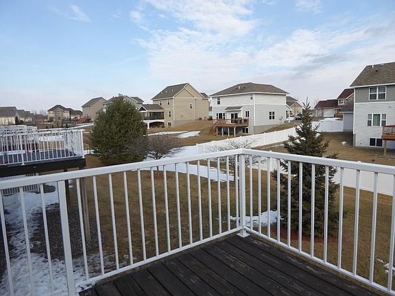 COME SIT A SPELL! Roomy deck with sweeping views over park like grounds.(Backs up to single family neighborhood)
