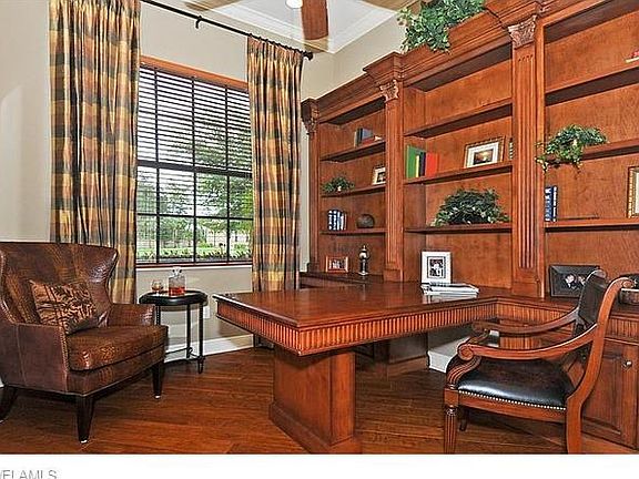 Rich wood built-in office & hammered wood flooring.