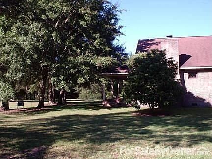 East side of cottage; the majestic trees
						:
						are priceless in this unusually huge fenced portion of the park-like grounds!!!