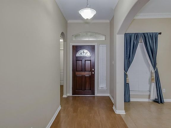 As you enter, to the right are 2 of the 3 bedrooms along with the full 2nd bath