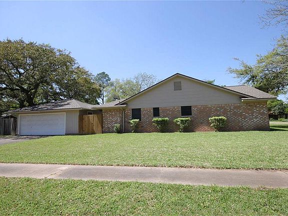 Lovely corner lot with detached garage and breezeway.