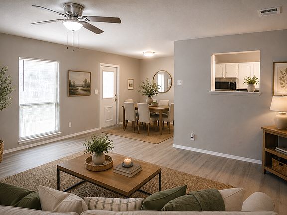 Virtually staged image. Dining furniture shown has been digitally added to help illustrate room size and layout. Home is vacant.